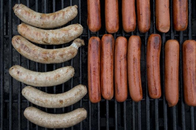 Alpine Kiwanis Brat Days is the organization's signature fundraising event. In this 2017 file photo, brats and hot dogs cook on the grill.