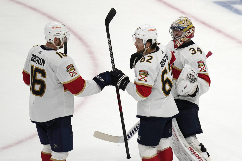 Florida Panthers center Aleksander Barkov (16), defenseman Brandon Montour (62) and goaltender Alex Lyon (34) celebrate the team's 6-3 win over the Boston Bruins in Game 2 in a first-round NHL hockey playoffs series Wednesday, April 19, 2023, in Boston. (AP Photo/Charles Krupa)
