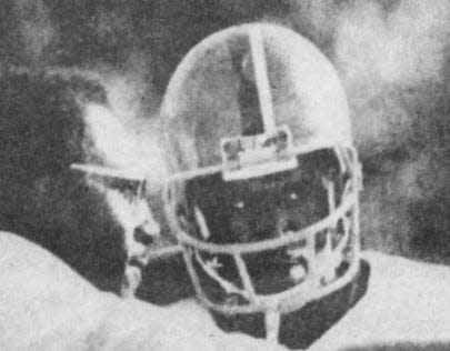 Head coach Rudy Hubbard gives instructions to quarterback Albert Chester during a game between FAMU and Bethune-Cookman in 1978.