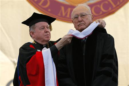 Boston Celtics legend and NBA hall of famer Bob Cousy receives an honorary Doctor of Humane Letters degree from college president William Leahy (L) during Commencement Exercises at Boston College in Boston, Massachusetts May 19, 2014. REUTERS/Brian Snyder