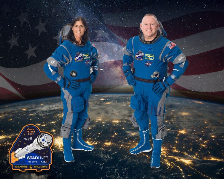 Sunita Williams and Barry Wilmore pose for the Starliner CFT crew portrait.