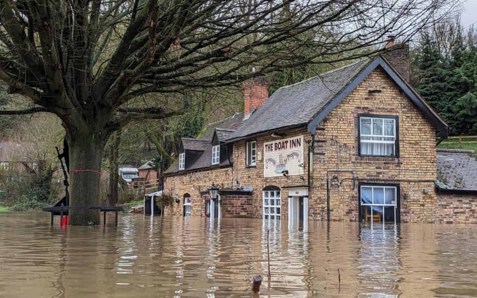 The Boat Inn in Shropshire is underwater following heavy rainfall and flooding
