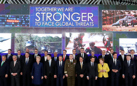 EU leaders take part in a group photo on the launching of the Permanent Structured Cooperation, or PESCO, a pact between 25 EU governments to fund, develop and deploy armed forces together, during a EU summit in Brussels, Belgium, December 14, 2017. REUTERS/Yves Herman