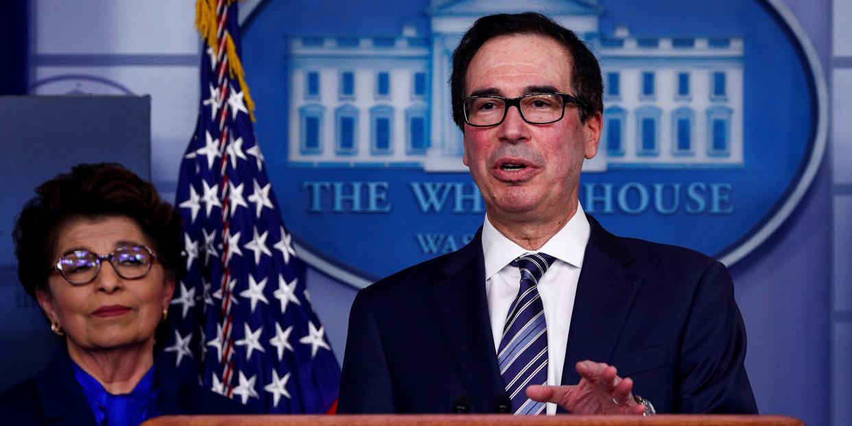 FILE PHOTO: Treasury Secretary Steven Mnuchin discusses details for economic relief during the daily coronavirus response briefing as Small Business (SBA) Administrator Jovita Carranza listens at the White House in Washington, U.S., April 2, 2020. REUTERS/Tom Brenner