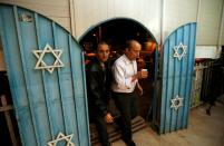 FILE PHOTO: Naftali Bennett, leader of the far-right Bayit Yehudi party, enters a synagogue before meeting supporters in Tel Aviv