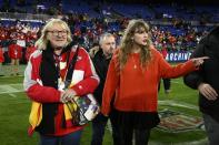 Taylor Swift, right, walks with Donna Kelce on the field after the AFC Championship NFL football game between the Baltimore Ravens and the Kansas City Chiefs, Sunday, Jan. 28, 2024, in Baltimore. (AP Photo/Nick Wass)