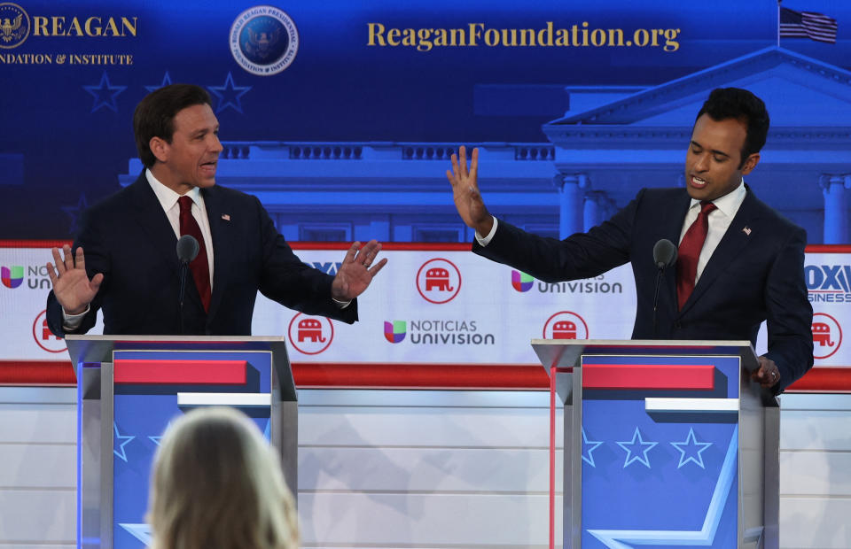 Florida Gov. Ron DeSantis, left, and businessman Vivek Ramaswamy trade barbs during the debate on Wednesday. 