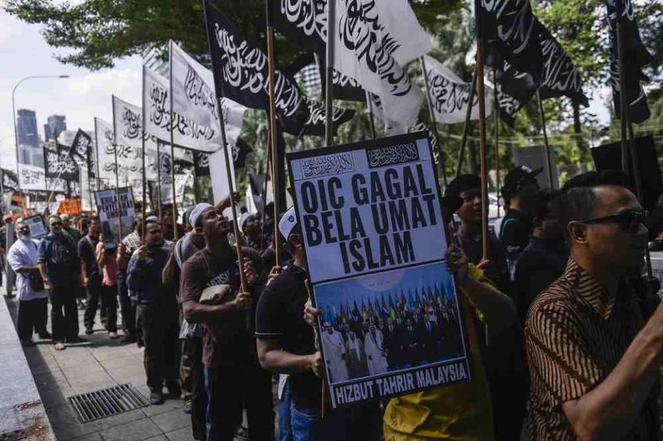 Hizbut Tahrir protesters carry placards during a protest held in solidarity with the Uighur community in China, December 27, 2019. ― Picture by Miera Zulyana