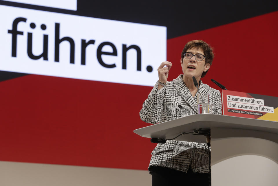 CDU General Secretary Annegret Kramp-Karrenbauer delivers her speech when running as chairwoman at the party convention of the Christian Democratic Party CDU in Hamburg, Germany, Friday, Dec. 7, 2018. 1001 delegates are electing a successor of German Chancellor Angela Merkel who doesn't run again for party chairmanship after more than 18 years at the helm of the party. (AP Photo/Michael Sohn)