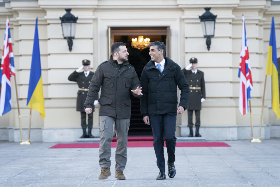 Prime Minister Rishi Sunak walks with President Volodymyr Zelenskyy during a visit to the Presidential Palace in Kyiv, Ukraine, to announce a major new package of £2.5 billion in military aid to the country over the coming year, Friday, Jan. 12, 2024. (Stefan Rousseau/Pool via AP)