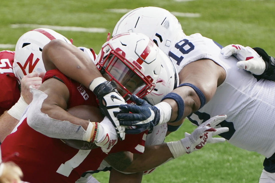 Nebraska wide receiver Wan'Dale Robinson (1) is tackled by Penn State defensive end Shaka Toney (18) during the second half of an NCAA college football game in Lincoln, Neb., Saturday, Nov. 14, 2020. Nebraska won 30-23. (AP Photo/Nati Harnik)