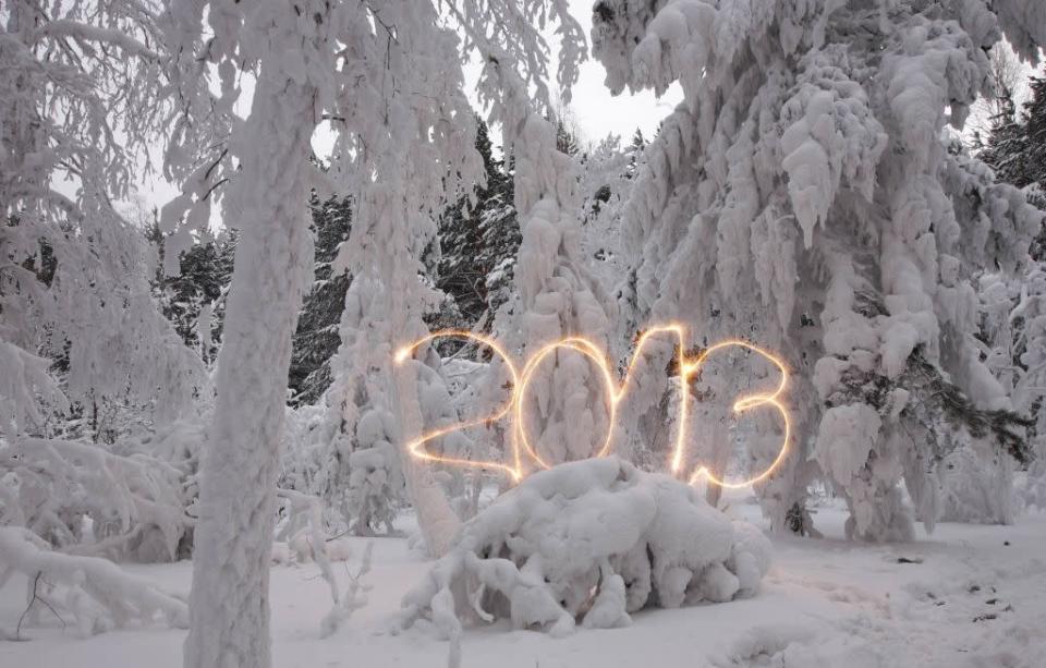 A reveller writes the number 2013 with sparklers ahead of New Year's Day at an air temperature of about -25 degrees Celsius (-13 F) in a forest outside Russia's Siberian city of Krasnoyarsk December 31, 2012. Picture taken with long exposure on December 31, 2012.