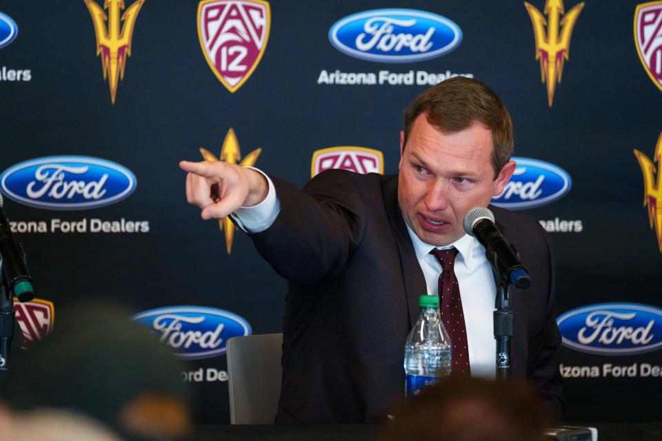 At a press conference to announce his position as Sun Devils football coach, Kenny Dillingham points towards friends in attendance on Nov. 27, 2022, in Tempe, AZ. Dillingham is an Arizona native and made note of his personal connections across the valley.