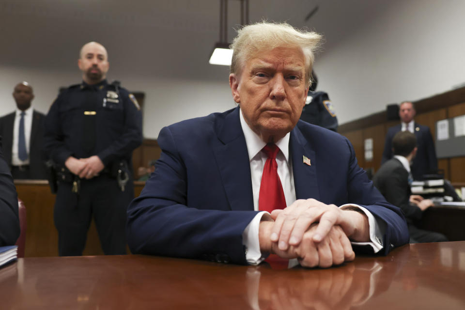 Former president Donald Trump waits for the start of proceedings in Manhattan criminal court, Tuesday, April 23, 2024, in New York. Before testimony resumes Tuesday, the judge will hold a hearing on prosecutors' request to sanction and fine Trump over social media posts they say violate a gag order prohibiting him from attacking key witnesses. (AP Photo/Yuki Iwamura, Pool)