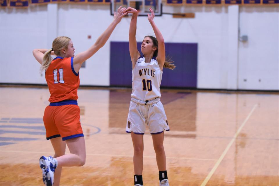 Wylie's Caroline Steadman (10) follows through on a shot during Tuesday's game against San Angelo Central at Bulldog Gym. Steadman scored a game-high 16 points in the 42-34 loss.