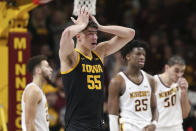 Iowa's Luka Garza (55) reacts after fouling out of an NCAA college basketball game against Minnesota, Sunday, Feb. 16, 2020, in Minneapolis. (AP Photo/Stacy Bengs)