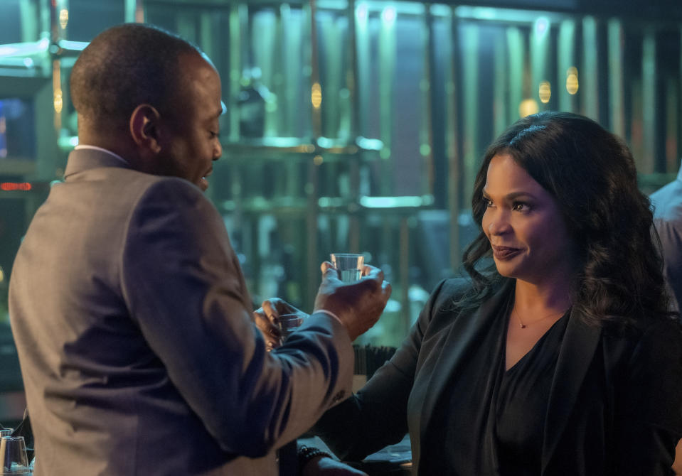 This image released by Netflix shows Nia Long, right, and Omar Epps in a scene from "Fatal Affair." (Beth Dubber/Netflix via AP)