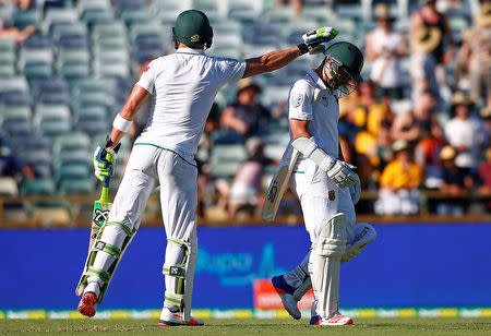 Cricket - Australia v South Africa - First Test cricket match - WACA Ground, Perth, Australia - 5/11/16 South Africa's Dean Elgar is patted on the helmet by his captain Faf du Plessis as he walks off the ground after being dismissed at the WACA Ground in Perth. REUTERS/David Gray