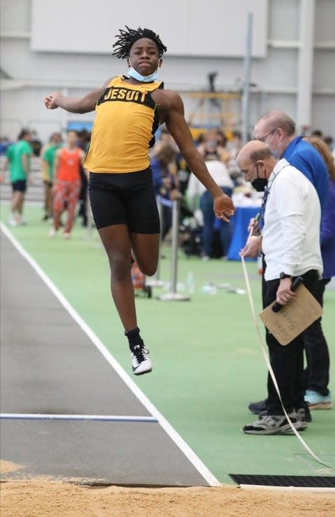 Rhoan Kaulder during the 2022 high school indoor track state long jump.