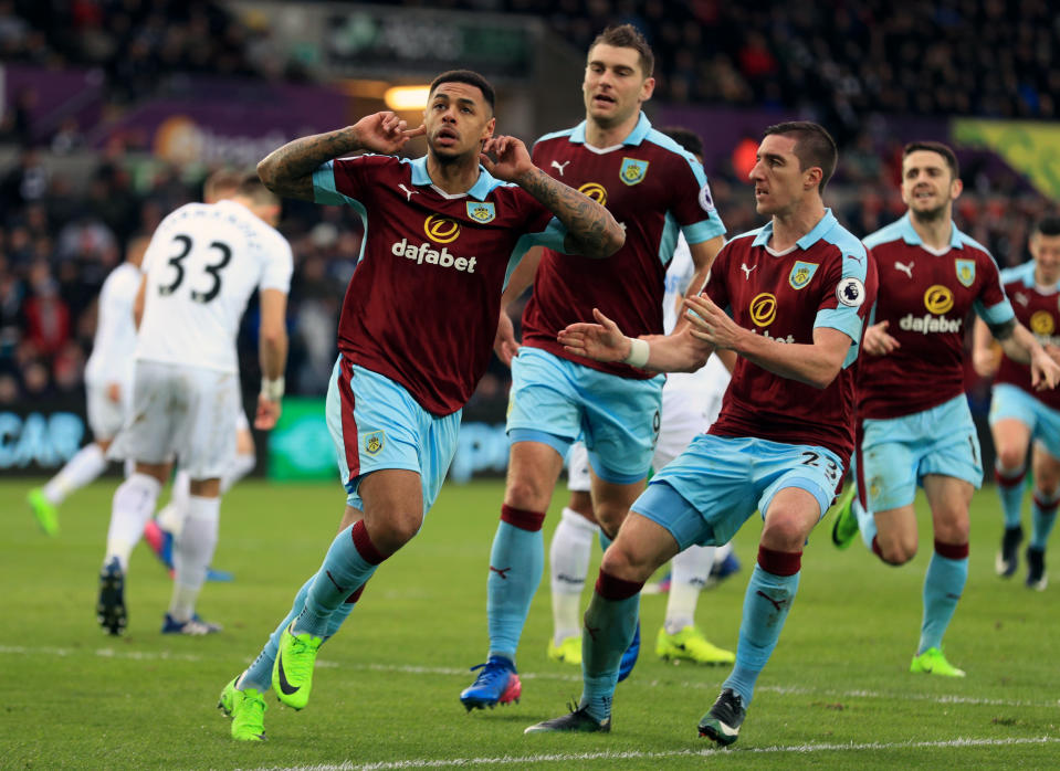  Defying the odds: Andre Gray celebrates for Burnley last season, when they again qualified for Europe. (PA)