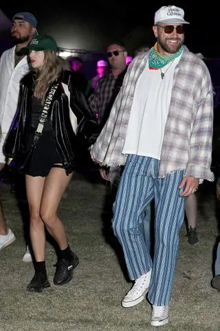 <p>Gilbert Flores/WWD via Getty</p> Kelce and his girlfriend Taylor Swift at Coachella on April 13