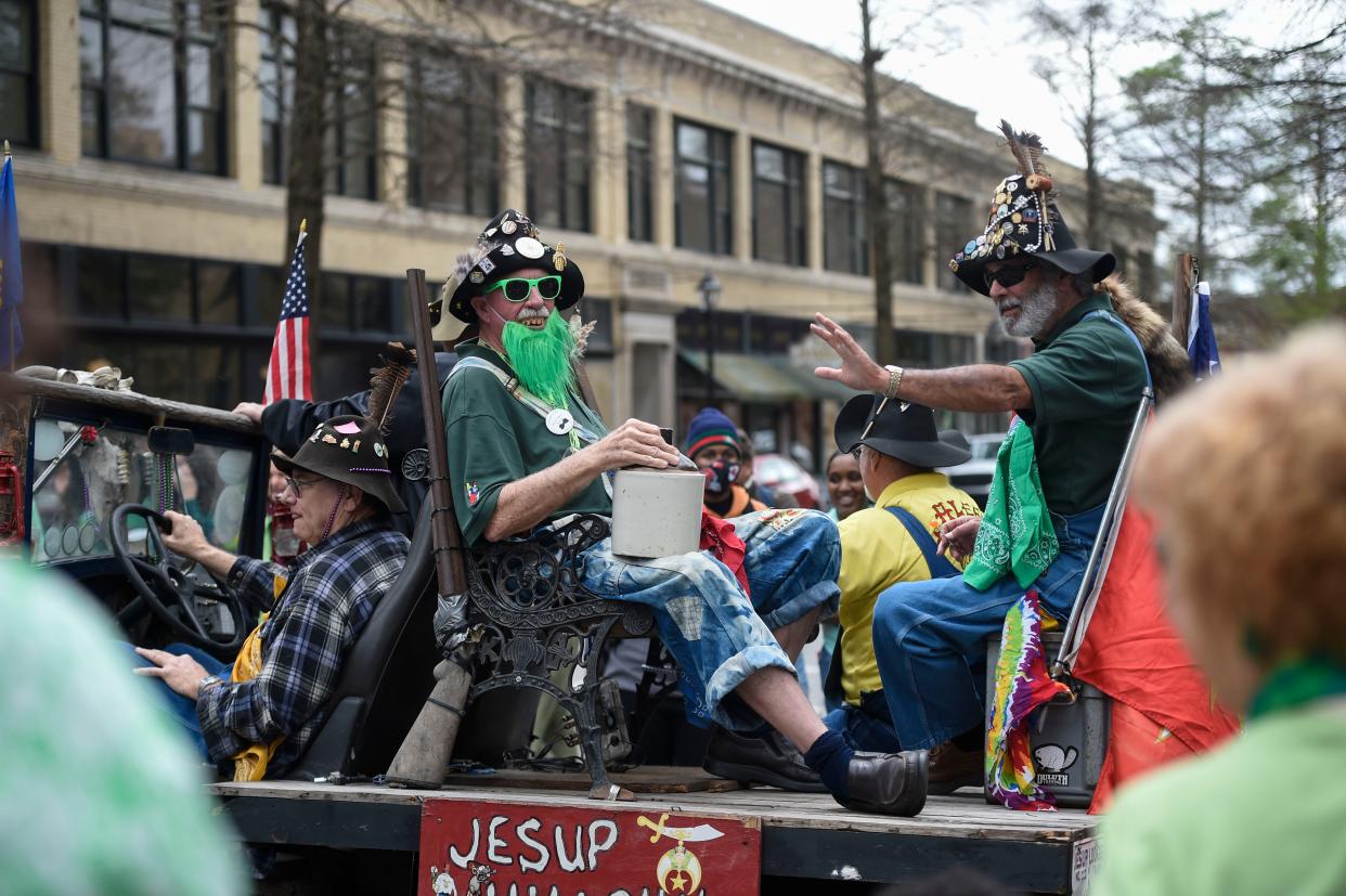 FILE - The Jesup Hillbillies sit on their float in the 45th annual St. Patrick's Day parade through downtown Augusta on Friday, March 17, 2023. The parade returns on Saturday at 2 p.m.