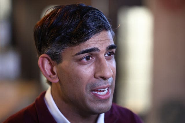 Rishi Sunak talks to the media during his visit to OmNom