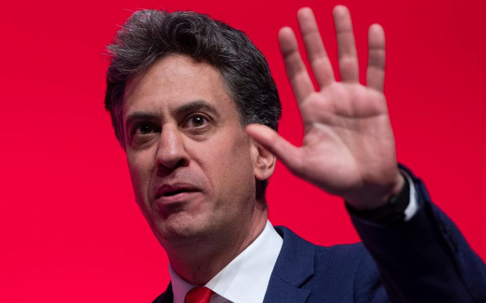 Ed Miliband raising his hand, speaking at the Labour party annual conference