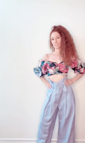 MAFS star Belinda Vickers models a floral top and blue trousers by Sheike