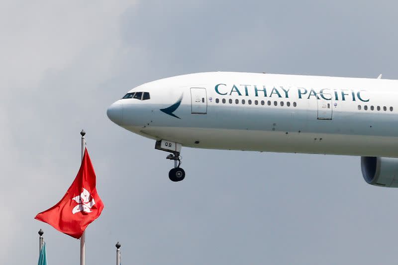 FILE PHOTO: A Cathay Pacific Boeing 777 plane lands at Hong Kong airport