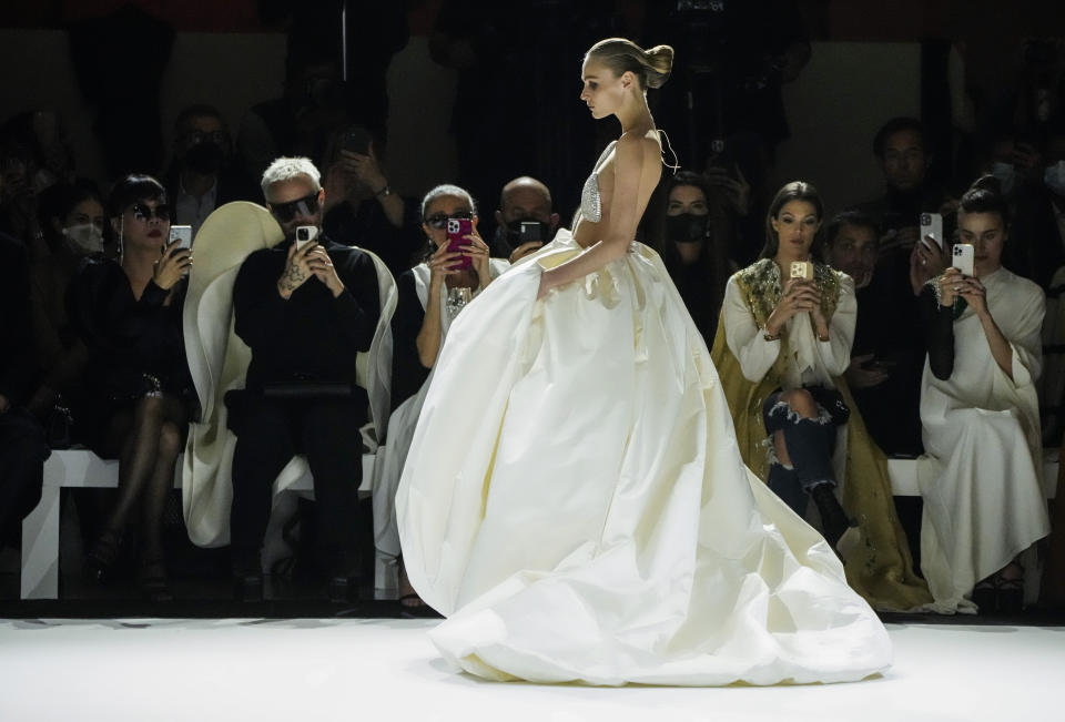 A model wears a creation for the Stephane Rolland Spring-Summer 2022 Haute Couture fashion collection, in Paris, Tuesday, Jan. 25, 2022. (AP Photo/Francois Mori)