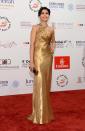<b>Metallic trend: </b>Freida Pinto opted for a warm gold Ralph Lauren gown to complement her skin tone at the Dubai Film Festival.
