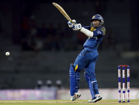 Sri Lanka's Tillakaratne Dilshan plays a shot during the first One Day International cricket match against West Indies in Colombo November 1, 2015. REUTERS/Dinuka Liyanawatte