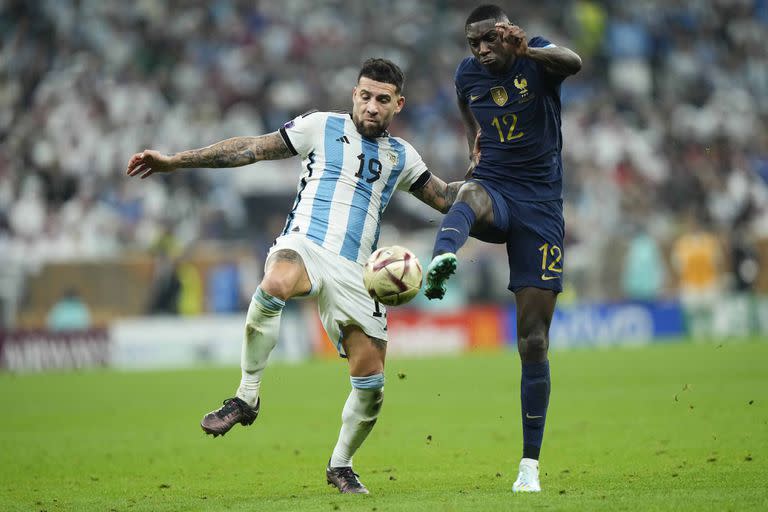 Nicolas Otamendi centre-back of Argentina and SL Benfica competes for the ball with Randal Kolo Muani centre-forward of France and Eintracht Frankfurt during the FIFA World Cup Qatar 2022 Final match between Argentina and France at Lusail Stadium on December 18, 2022 in Lusail City, Qatar. (Photo by Jose Breton/Pics Action/NurPhoto via Getty Images)