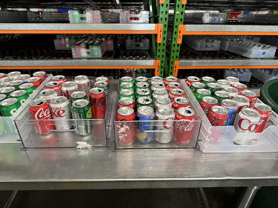 Offloaded cans waiting to be sorted for recycling or reloading.