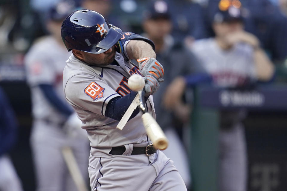 Houston Astros second baseman Jose Altuve (27) breaks his bat during an out against the Seattle Mariners during the fifth inning in Game 3 of an American League Division Series baseball game Saturday, Oct. 15, 2022, in Seattle. (AP Photo/Abbie Parr)