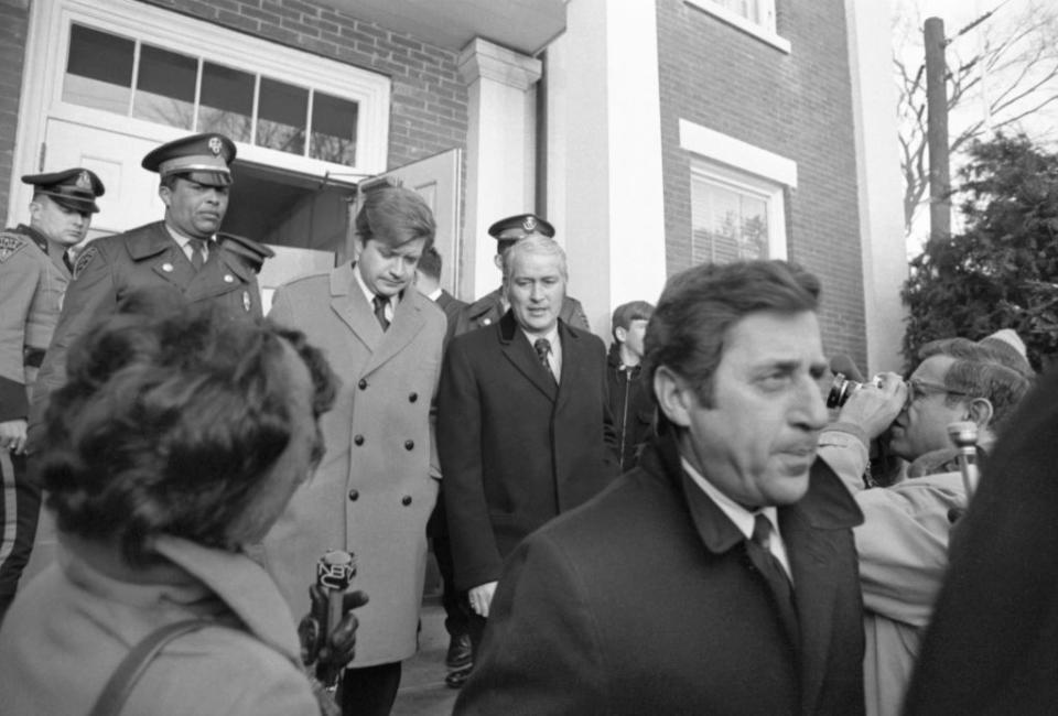 Two sailing companions of Senator Edward M. Kennedy who were present at the 7/18/1969 party on Chappaquiddick Island—Raymond Larosa (R) and Charles Tretter (L), leave Dukes County Court House after first day of inquest into the death of Mary Jo Kopechne. Center is Paul J. Redman, one of their attorneys. Miss Kopechne was killed when Senator Edward Kennedy’s car plunged off a bridge into water on Chappaquiddick Island. (Photo by Bettmann Archive/Getty Images)<span class="copyright">Bettmann Archive</span>