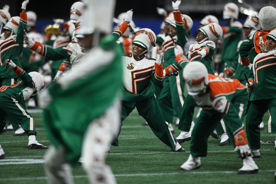 The Florida Au0026M marching band performs at halftime during the university's Cricket Celebration Bowl game against Howard University at Mercedes-Benz Stadium. FAMU won 30-26 on Dec. 16, 2023, in Atlanta, Georgia.