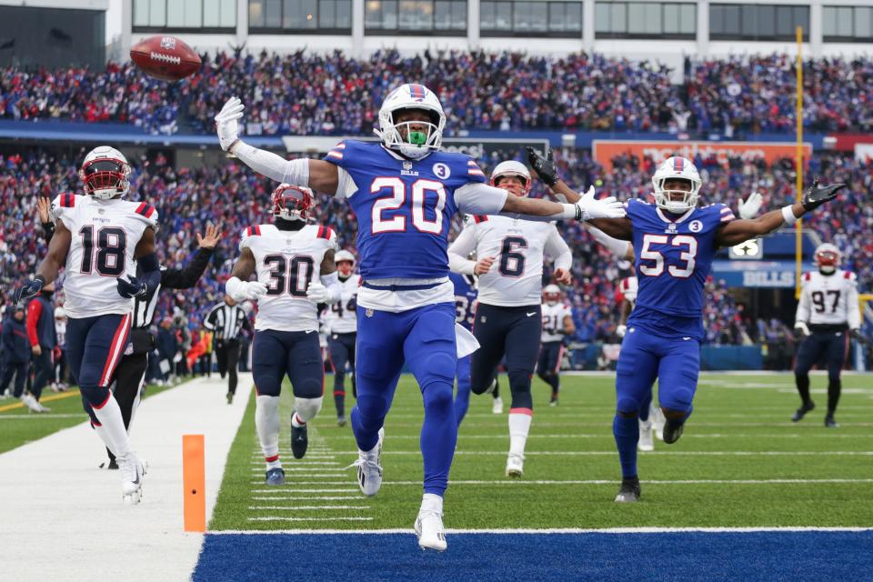 Buffalo Bills running back Nyheim Hines (20) scores a touchdown on a kickoff return during the first half of an NFL football game against the New England Patriots on Sunday, Jan. 8, 2023, in Orchard Park, N.Y. (AP Photo/Joshua Bessex)