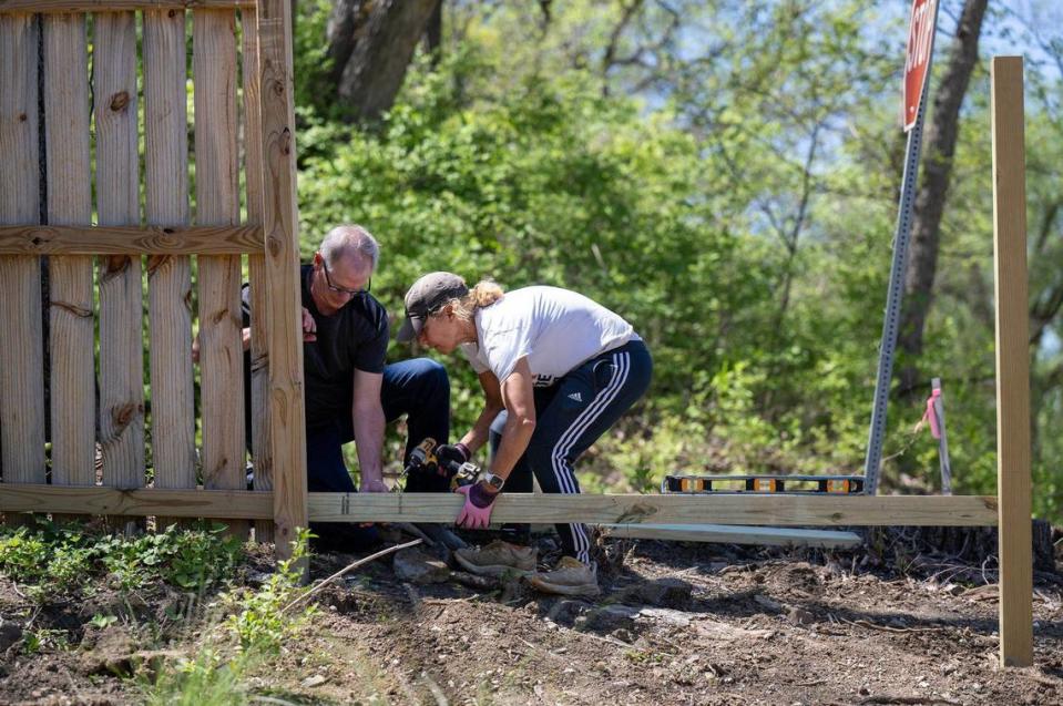 Phil Jorgenson, left, secretary, and Katrina Gerber, president, of Eden Village of Kansas City, work on a fence at the tiny home community that will open in May and house chronically homeless individuals on four-acres at 1001 Metropolitan Ave., in Kansas City, Kansas. Tammy Ljungblad/Tljungblad@kcstar.com