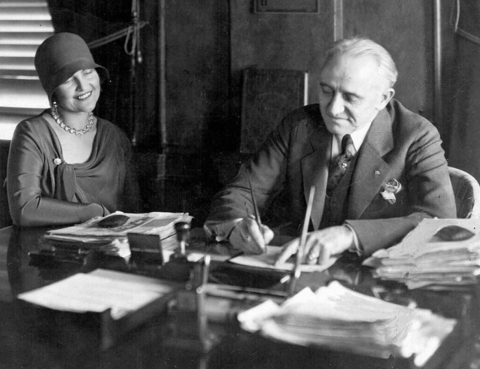 This 1929 photo shows former Memphis, Tenn. movie censor Lloyd Binford at his desk. The woman at left is unidentified. For almost 30 years, Binford had practically total control over which movies were shown in Memphis. He banned films if black actors had anything more than menial roles, and he rejected movies starring actors he personally disliked. (AP Photo/The Commercial Appeal, File)