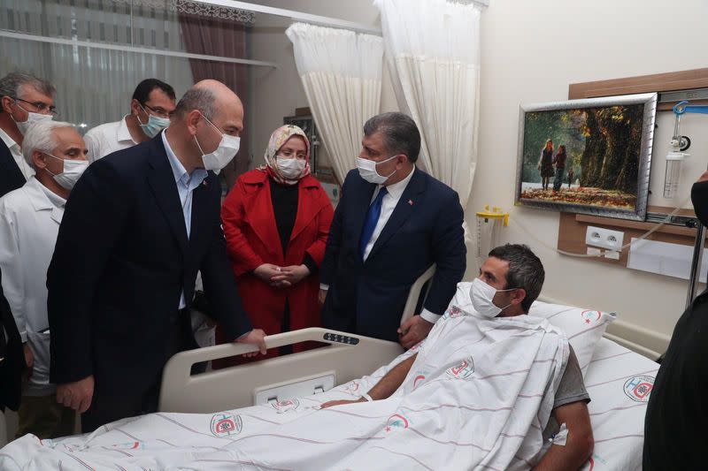 Turkish Ministers visit a person who was wounded following a blast at a firework factory in Hendek