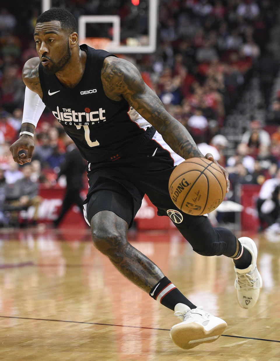 Washington Wizards guard John Wall dribbles during the first half of an NBA basketball game against the Houston Rockets, Wednesday, Dec. 19, 2018, in Houston. (AP Photo/Eric Christian Smith)