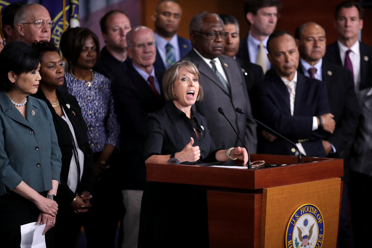 Congressional Hispanic Caucus Chair Rep. Michelle Lujan Grisham, D-N.M., is joined by Democratic members of the House of Representatives to mark Immigrant Rights Day at U.S. Capitol, May 1, 2017. (Photo: Chip Somodevilla/Getty Images)