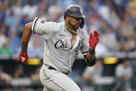 Chicago White Sox's Eloy Jimenez attempt to beat the throws to first base as he hit a ground ball during the fourth inning of a baseball game against the Kansas City Royals at Kauffman Stadium in Kansas City, Mo., Monday, July 26, 2021. (AP Photo/Colin E. Braley)