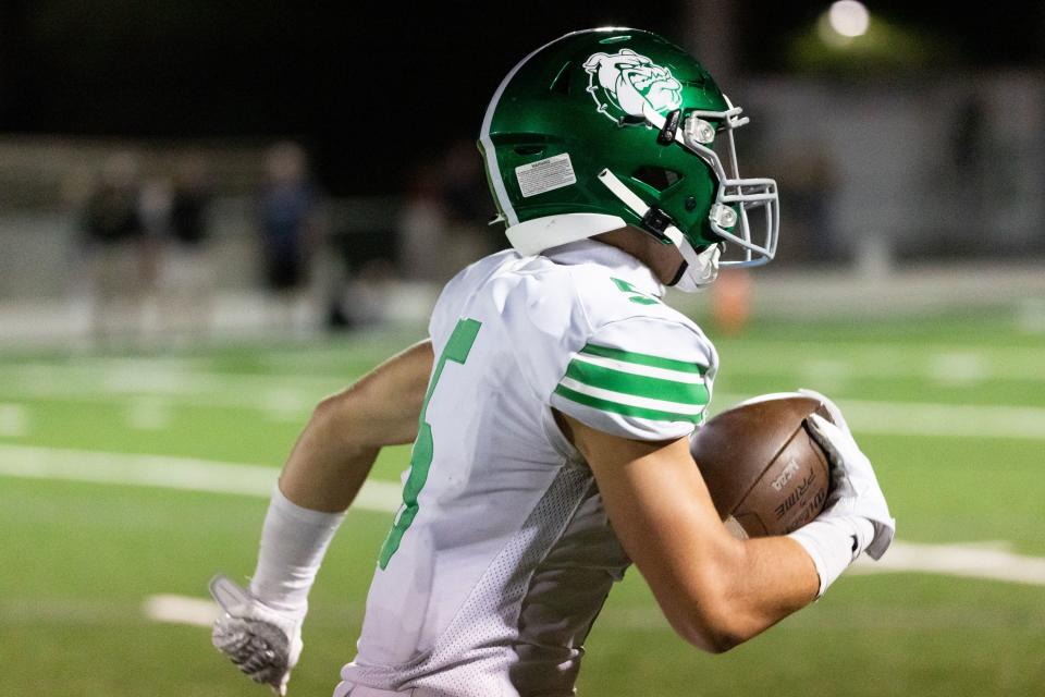 Provo’s Bryant&nbsp;Larsen catches the ball and runs it into the end zone for a touchdown, bringing Provo up 21-20, in the fourth quarter of the football game against Olympus at Olympus High School in Holladay on Friday, Aug. 18, 2023.