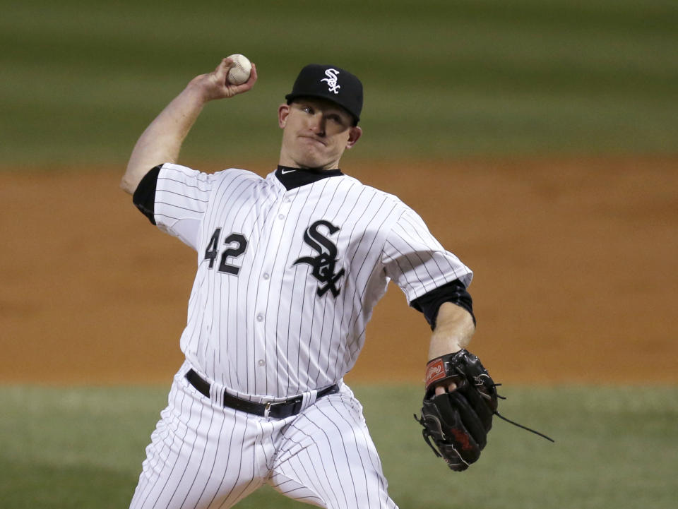 Chicago White Sox starting pitcher Erik Johnson delivers during the third inning of a baseball game against the Boston Red Sox on Tuesday, April 15, 2014, in Chicago. (AP Photo/Charles Rex Arbogast)