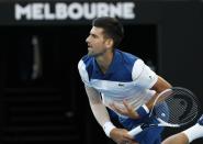 Tennis - Australian Open - Rod Laver Arena, Melbourne, Australia, January 22, 2018. Novak Djokovic of Serbia serves against Chung Hyeon of South Korea. REUTERS/Issei Kato