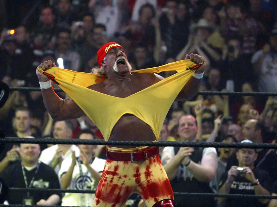 Hulk Hogan fires up the crowd between matches during WrestleMania 21 in Los Angeles. Hogan, perhaps the biggest star in WWE's 50-year history, is set to bring the red-and-yellow back to the sports entertainment behemoth and will host the April 6, 2014, WrestleMania in New Orleans. (AP Photo/Chris Carlson, File)