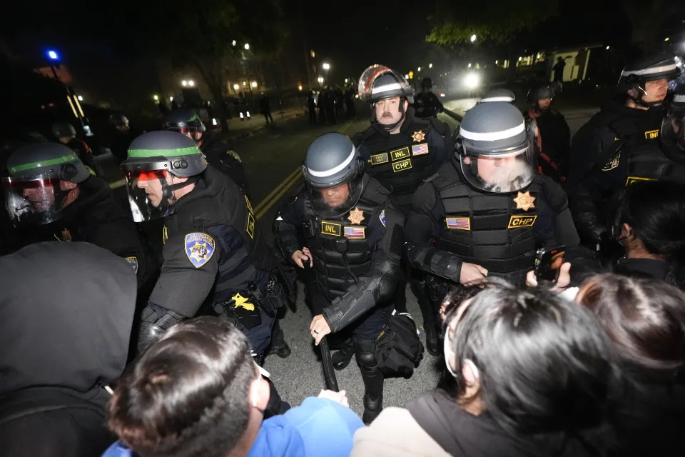 Police advance on demonstrators on the UCLA campus, in Los Angeles. (AP Photo/Ryan Sun)